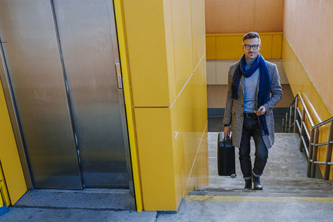 man walking up stairs