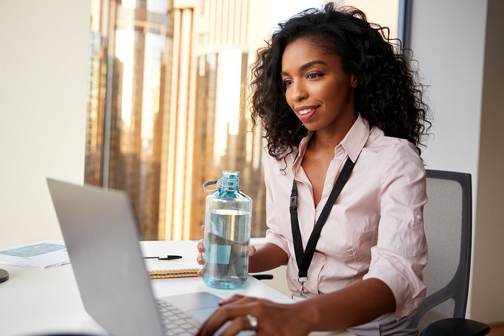 woman typing on laptop